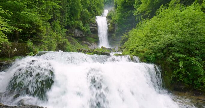 Giessbach waterfalls in the bernese Alps, Interlaken region, Switzerland. Cloudy summer day, green vegetation, real time, no people, Giessbachfälle