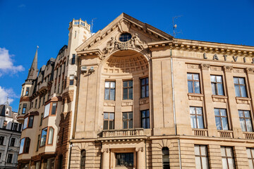 Fototapeta na wymiar Riga, Latvia, 14 October 2021: facade of historic radio building Dome Square, Key to Riga landmark of Old town, UNESCO recognized architecture at sunny day