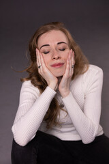 Portrait of thoughtful, dissatisfied, pensive young woman. Blong girl face isolated. Emotional...