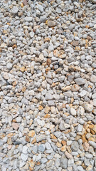 Cover page with gravel, river beach pebble, stony background with patterns, closeup, details.