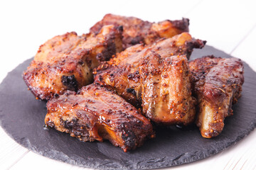 Grilled pork ribs on slate board
