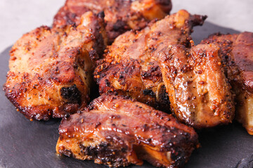Grilled pork ribs on slate board