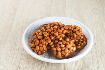 Ampyang Kacang or Gula Kacang, Indonesian traditional snack, made from peanuts and brown sugar. The taste of this snack is very sweet.
