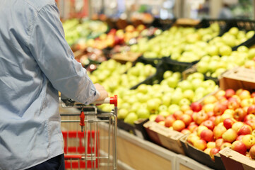 Man buying apples at the market