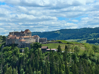Fototapeta na wymiar Château de Joux, France - May 2022: View of the 19th century Château de Joux during a walk in the French Jura