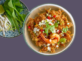 Top view of Thai Crispy rice noodles in traditional style with prawn, Royal recipe, with vegetable, with copy space and white background with clipping path