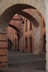 Fototapeta na wymiar Brick interior arcade in the old citadel