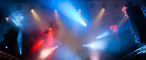 Fototapeta Spot lights on the stage during night concert in summer	
 obraz