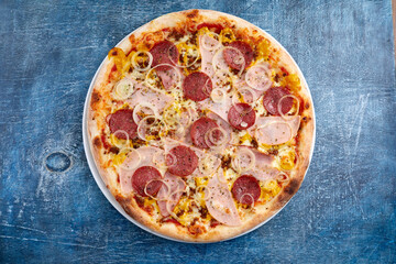 tasty italian pizza on wooden background