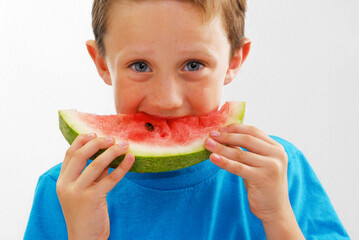 Happy kid eating watermelon fruit portrait on white background.