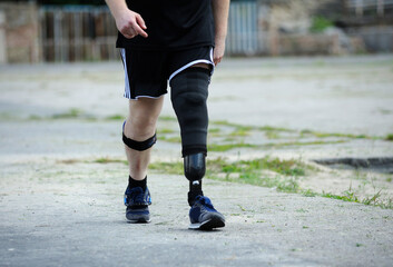 Fototapeta na wymiar one-legged runner walking on a stadium