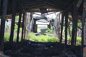 Photos of the inside of a ramshackle barn on an abandoned farm	
