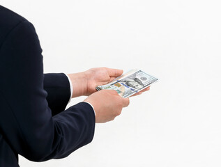 A hand bribing a bundle of 100 dollar bills