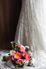 Elegant wedding bouquet on a wedding dress