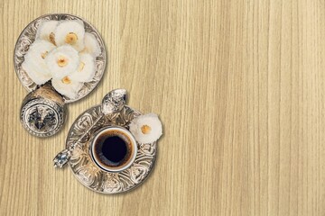 Ramadan food, Turkish coffee and dates zinc tray on desk.