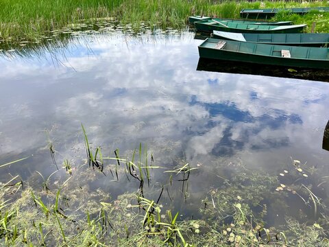Boats on the river. Landscape photography with water reflection
