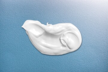White Ñosmetic cream texture. Ð¡reamy product on texture background. Sunscreen for face creme, body lotion.