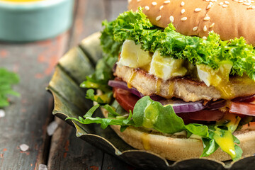 tasty burger fast food hamburger with beef chicken and feta cheese, American food. fast food, banner, menu, recipe place for text