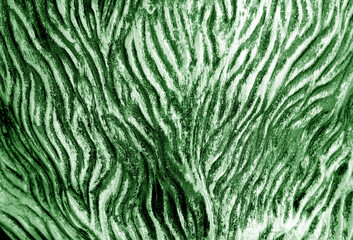 Metal rough surface with blur effect in green tone.