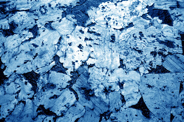 Cork board texture in navy blue tone.