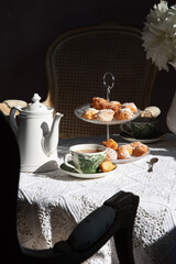 tea break in english style, vintage still life, homemade buns, a bouquet dalias