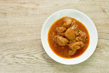 boiled spicy pork belly in curry soup or Hang leh Thai northern style food on plate