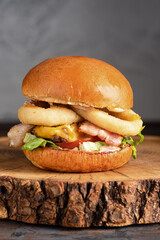 burger with meat, burger on a wooden table, juicy burger with different fillings