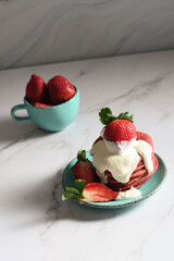 still life with Pink strawberry pancakes on a turquoise plate with sour cream