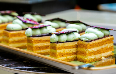 Several puff small pieces of cakes on a plate