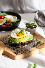 Sandwich with avocado and fried egg