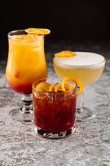 Some colored alcoholic cocktails on black background