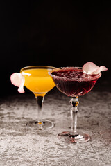 Some colored alcoholic cocktails on black background