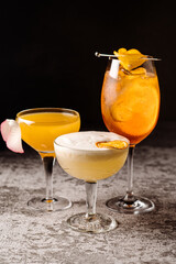 Some colored alcoholic cocktails on black background