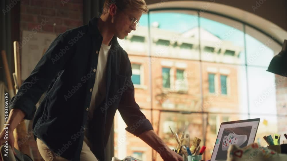 Aufkleber teenage artist compares hand crafted shoes with 3d model on laptop computer. artist is customising h