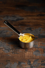 Cheese sauce, mustard, sour cream, tomato, sweet and sour sauce on a wooden background