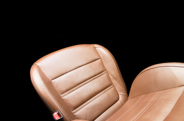 Modern luxury car brown leather interior. Part of orange leather car seat details with white...