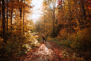 Couple embracing each other in autumn forest in Canada