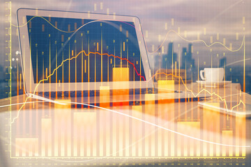 Forex market graph hologram and personal computer on background. Multi exposure. Concept of investment.