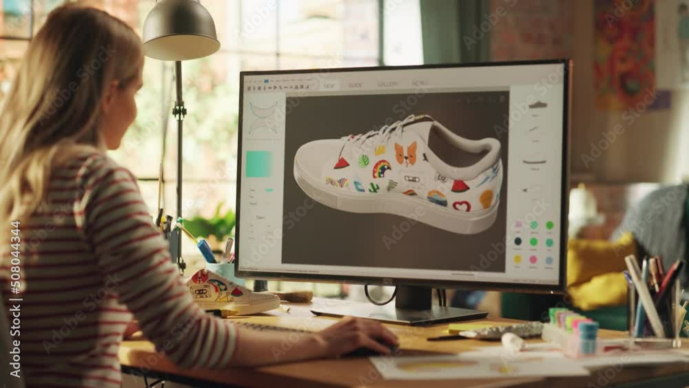 Leinwandbilder Progressive Teen Female Designer Choose Colours and Patterns while Modelling 3D Shoe at her Professional Desktop Computer. Woman Creating, Designing a New 3D Model in CAD Program. Freelance Work