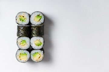 Sushi rolls maki with rice and avocado