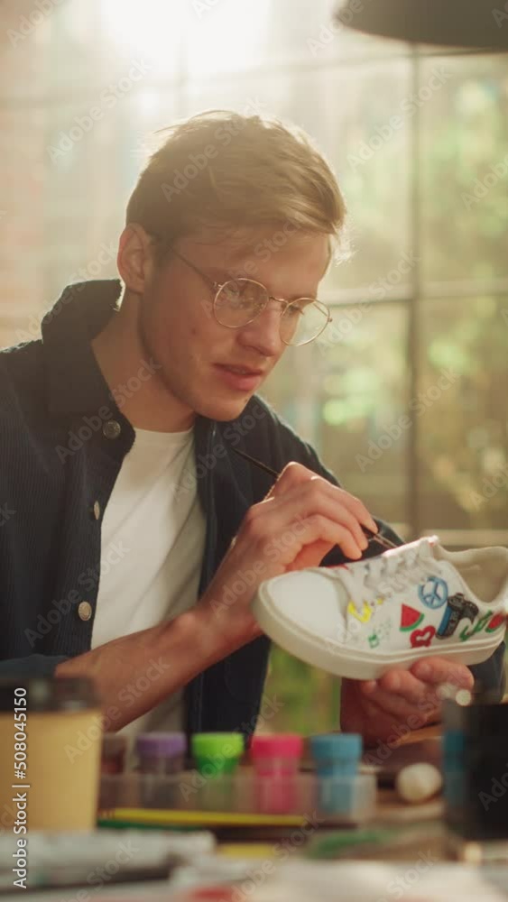 Aufkleber creative designer sitting at his workplace and drawing new patterns at shoes. inspired man creating 