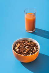Granola with almond and peanut in orange bowl - 508045153