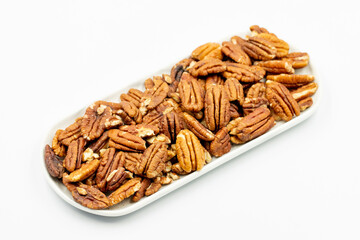 Pecan walnuts on white background. close up