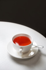 Red fruit tea in a white wooden table