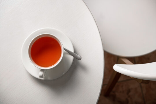 Red fruit tea in a white wooden table