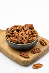 Pecan walnuts on white background. close up