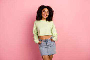 Photo of young cheerful woman confident good mood wear modern outfit isolated over pink color...