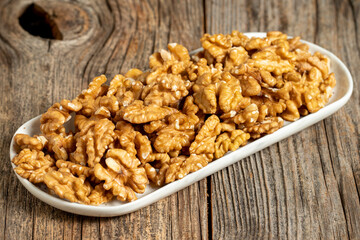 Walnut on wooden background. Close-up walnut kernel