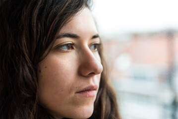 Expressive indoor portrait of an Italian girl looking away