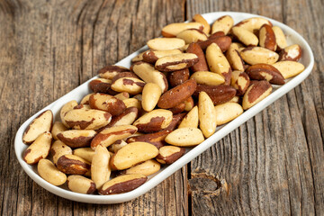 Brazil walnut on wooden background. Close-up brazil walnut kernel